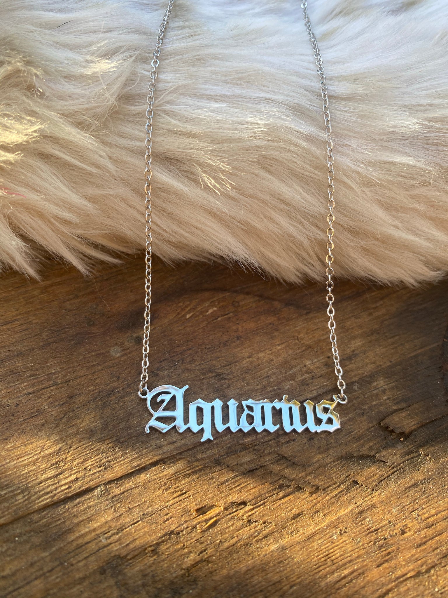 Claire's Silver-Tone Gothic Zodiac Pendant Necklace - Aquarius | £3.20 |  Buchanan Galleries